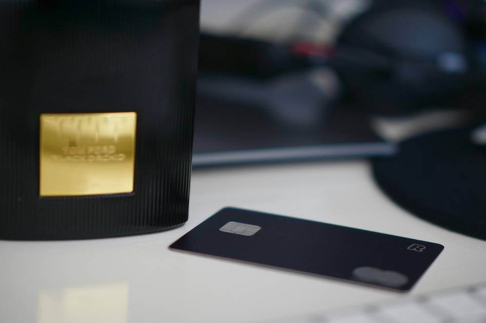 Elegant metal credit card on dark background with gold accents